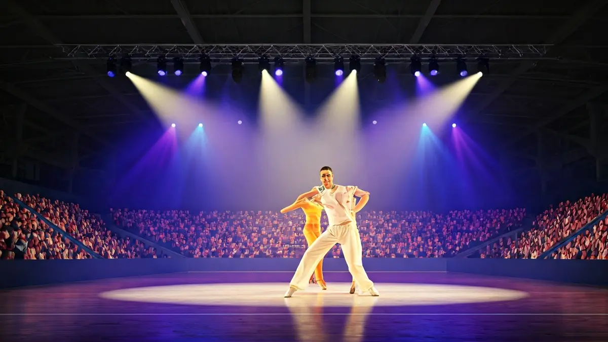 Generic image of a dance competition stage with lights and a blurred audience.