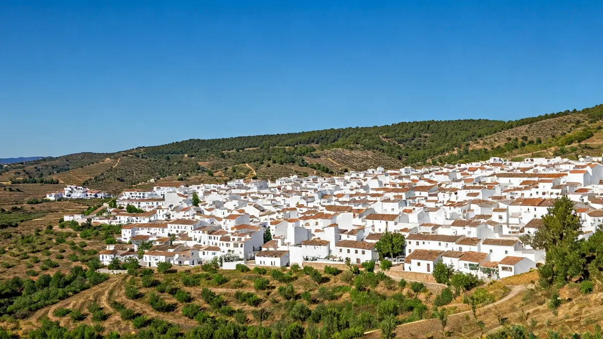 Image of a rural Andalusian village with white houses, symbolizing depopulation.