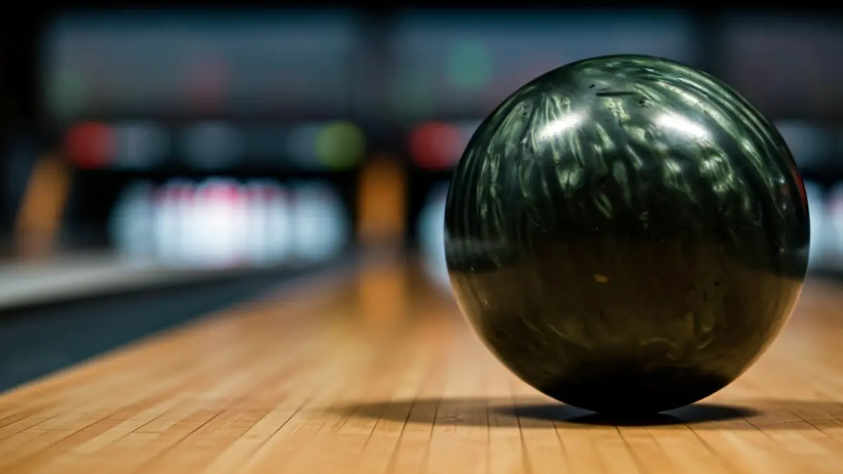 Generic image of a bowling ball on a lane.