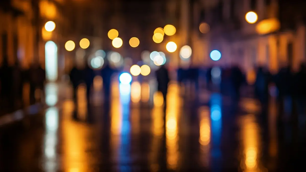Generic image of emergency lights reflecting on a wet street at night.