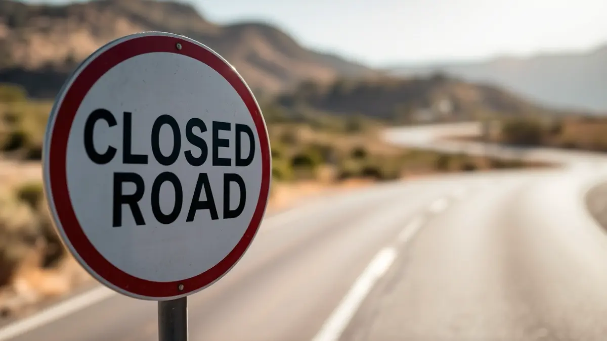 Generic image of a closed road sign in an Andalusian landscape.