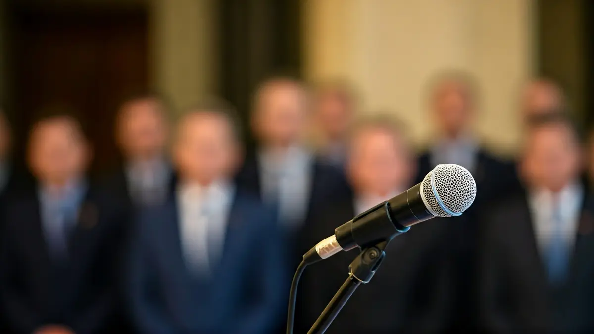 Generic image of a microphone on a podium during a political presentation.