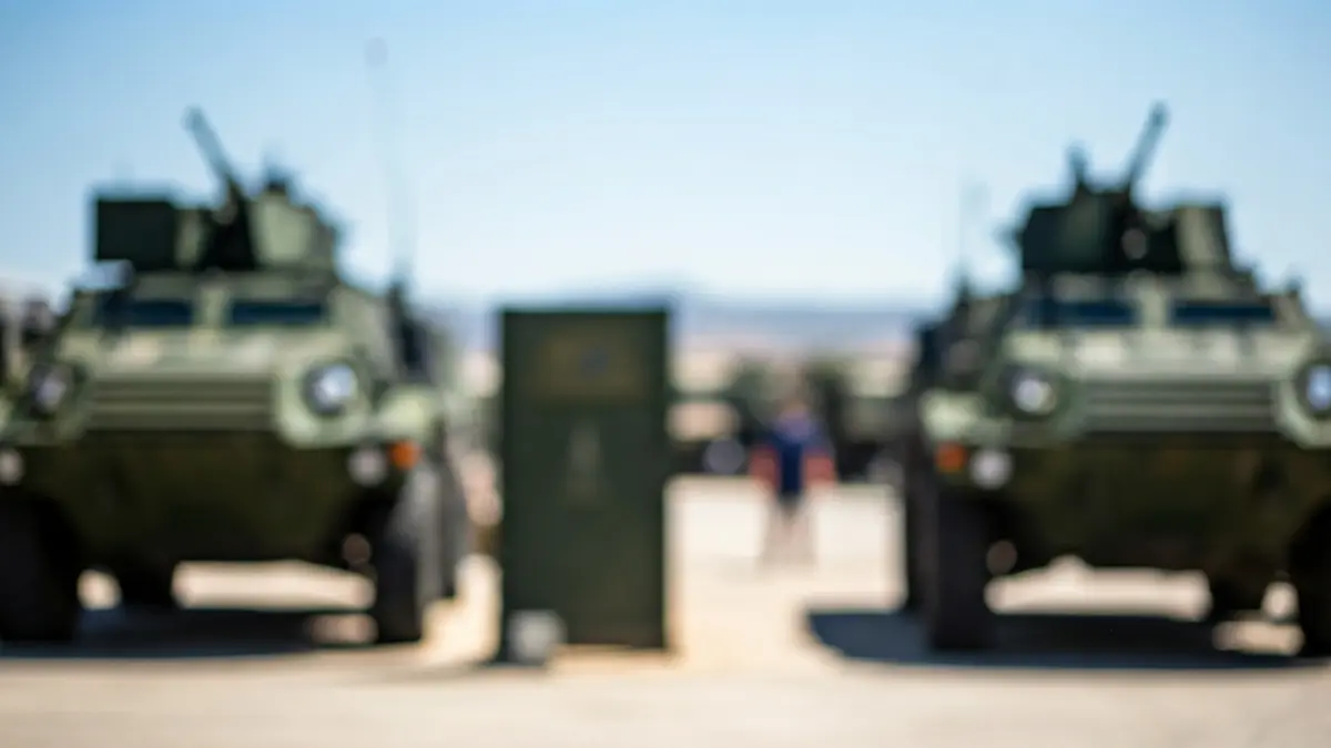 Image of a military base entrance on a sunny day.