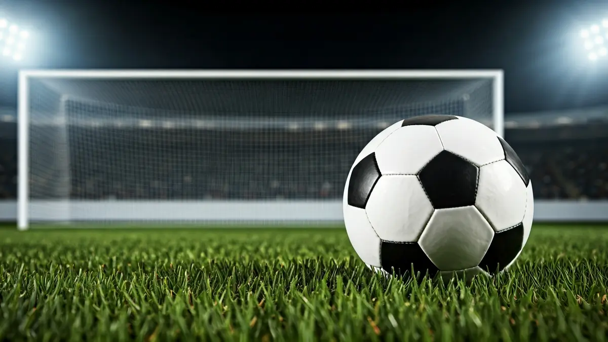 Generic image of a soccer ball on a stadium pitch.