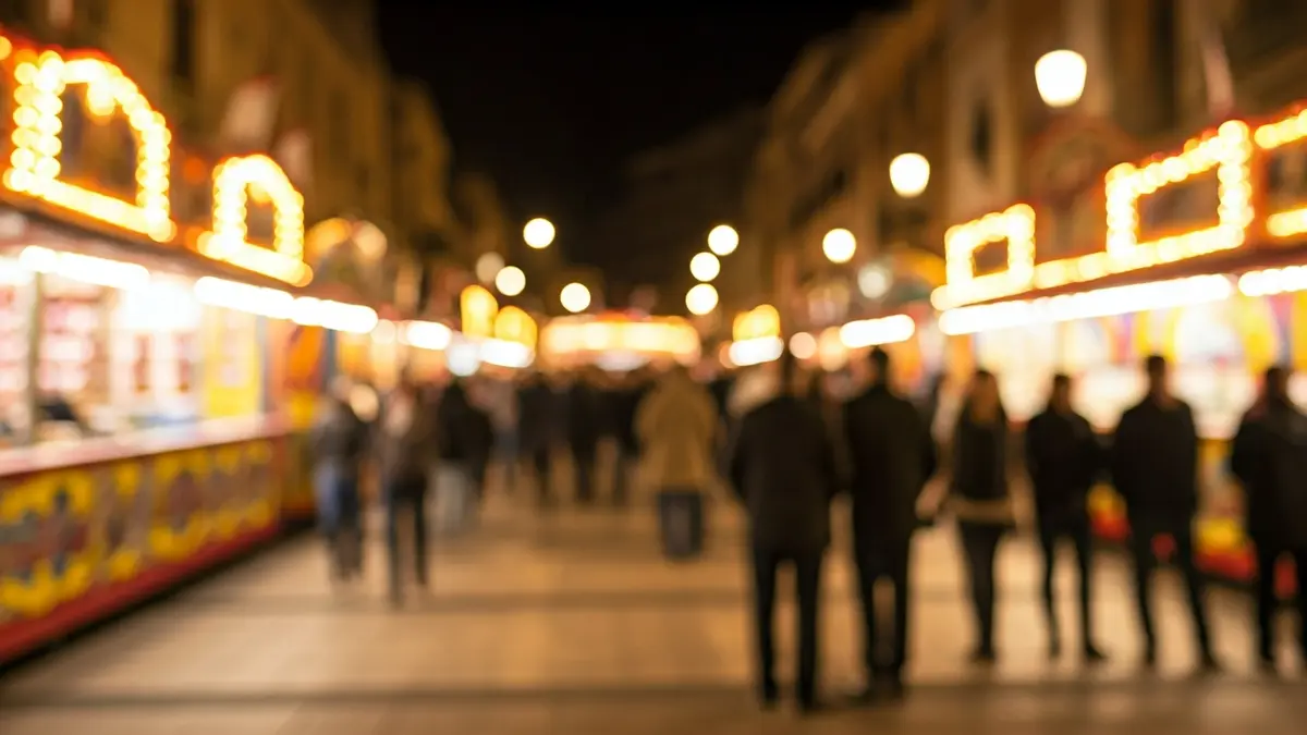 Imagen genérica de una feria nocturna con luces y ambiente festivo.