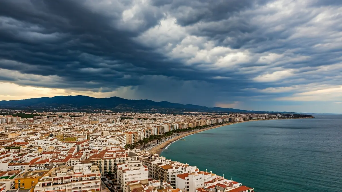 Generic image of storm clouds over an Andalusian coastal city.