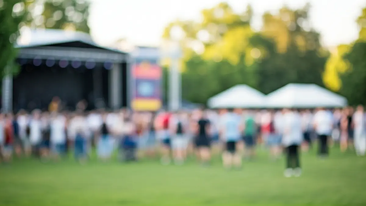 Image of an outdoor music festival in an urban park.