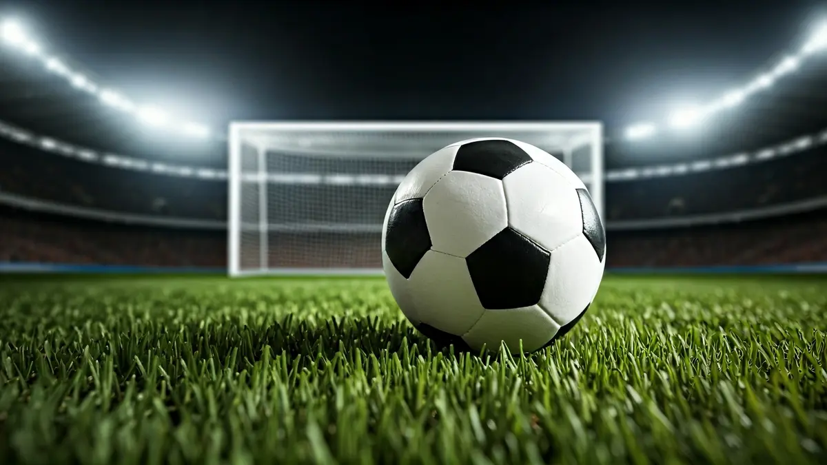 Generic image of a soccer ball on a stadium pitch.