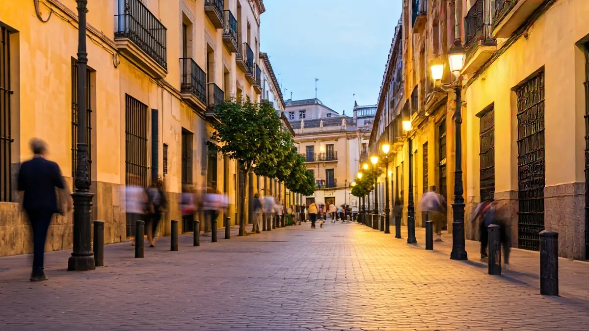 Image of a festive atmosphere in Sevilla with traditional Andalusian architecture.