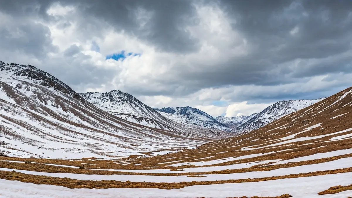 Image of Sierra Nevada with snow tinted brown by Saharan dust.