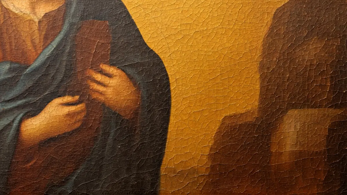 Imagen de un cuadro antiguo con signos de deterioro, mostrando la necesidad de restauración.