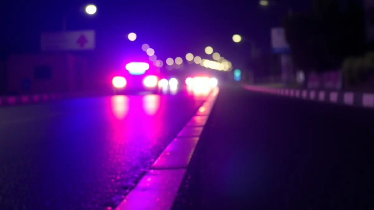 Generic image of emergency lights on asphalt.