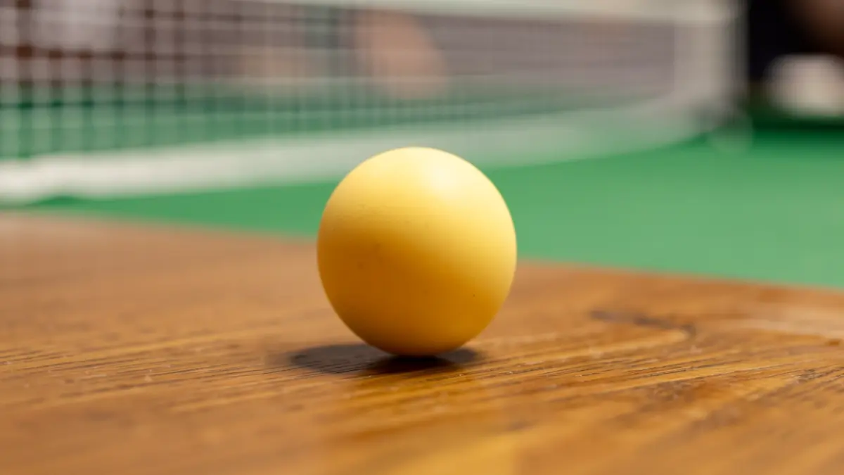 Generic image of a table tennis ball on a table.