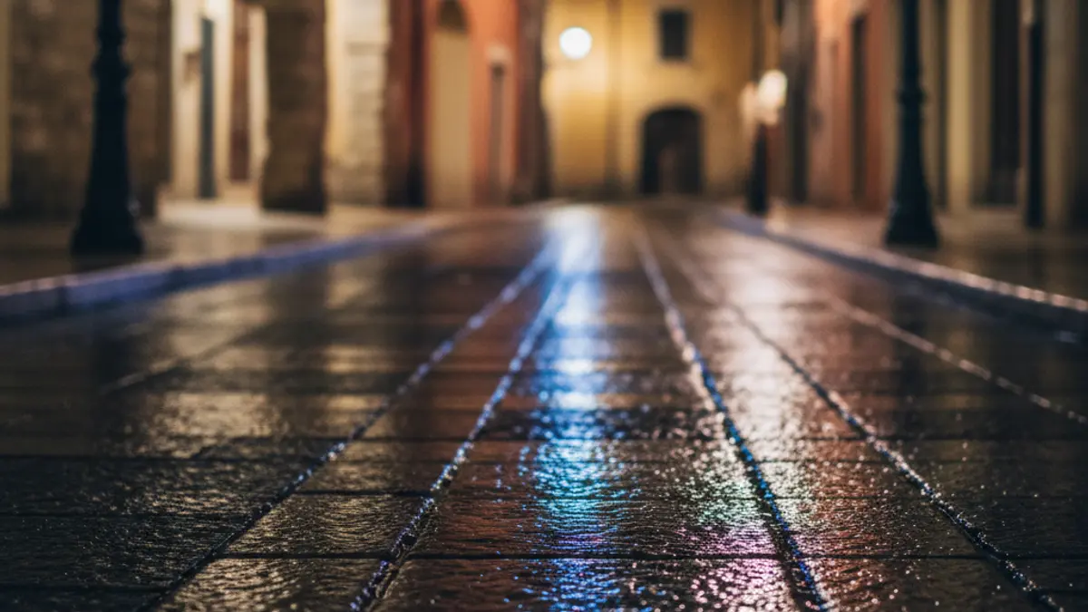 Generic image of emergency lights reflecting on wet asphalt at night.