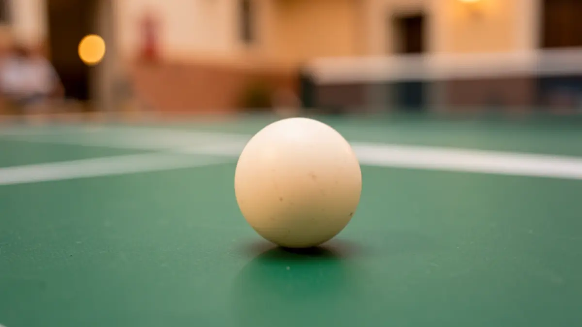 Generic image of a table tennis ball on a table.