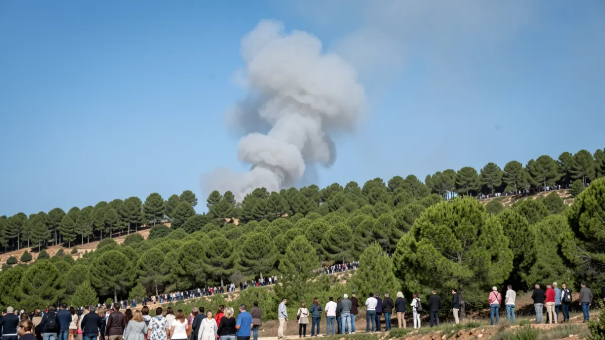 Generic image of wildfire smoke rising from a pine-covered hillside in Andalusia.
