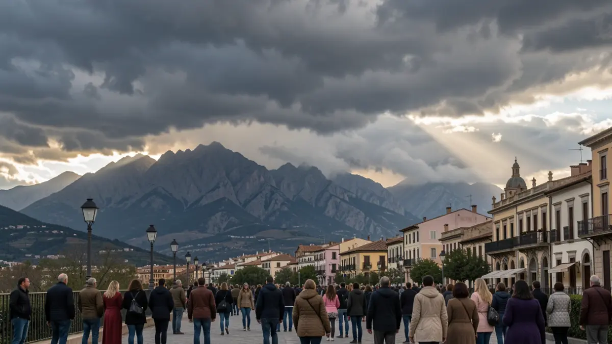 Storm clouds gathering over the Sierra Nevada mountains near Granada, with a hint of sunlight breaking through.