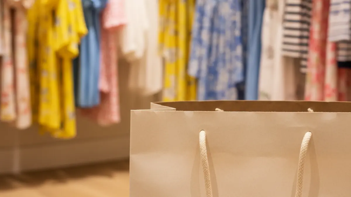 Generic image of a shopping bag in a store setting, symbolizing summer sales.