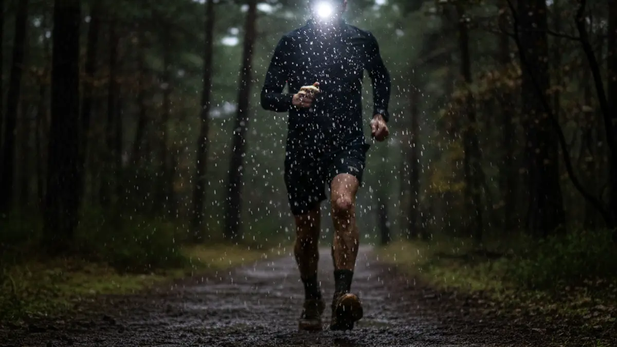 Generic image of an ultra-distance runner at night, with rain and wind.