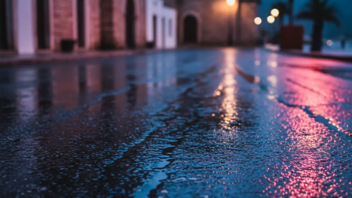 Generic image of emergency lights reflected on wet asphalt.