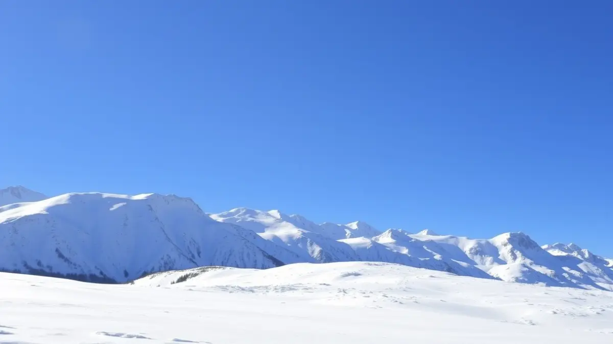 Image of Sierra Nevada covered in snow in May, with a blue sky in the background.