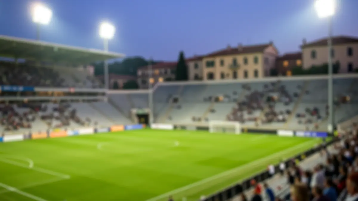Generic image of an empty football stadium at dusk.