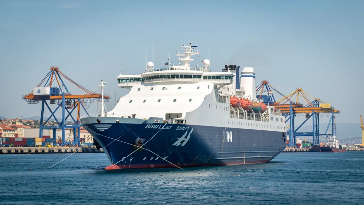 Generic image of a ferry docked at a Mediterranean port.