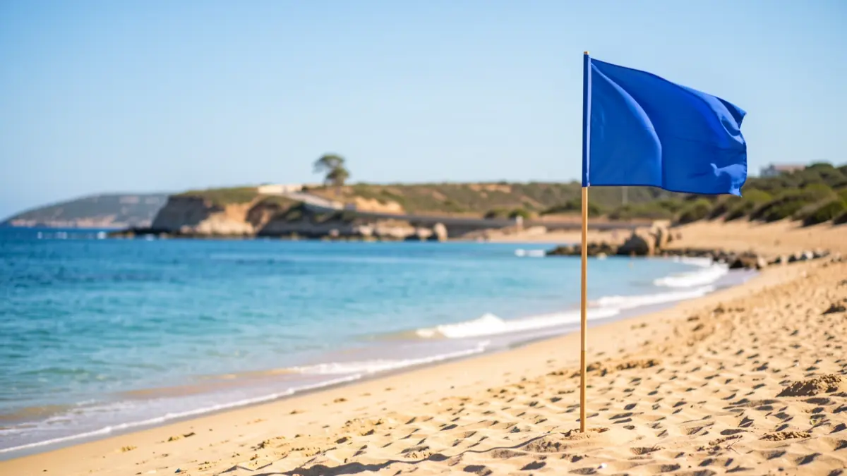 Generic image of an Andalusian beach with a Blue Flag and coastal path.
