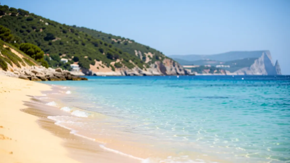 Image of Sobrevela Beach in La Línea de la Concepción, Cádiz, featuring crystal-clear waters and views of the Rock of Gibraltar.