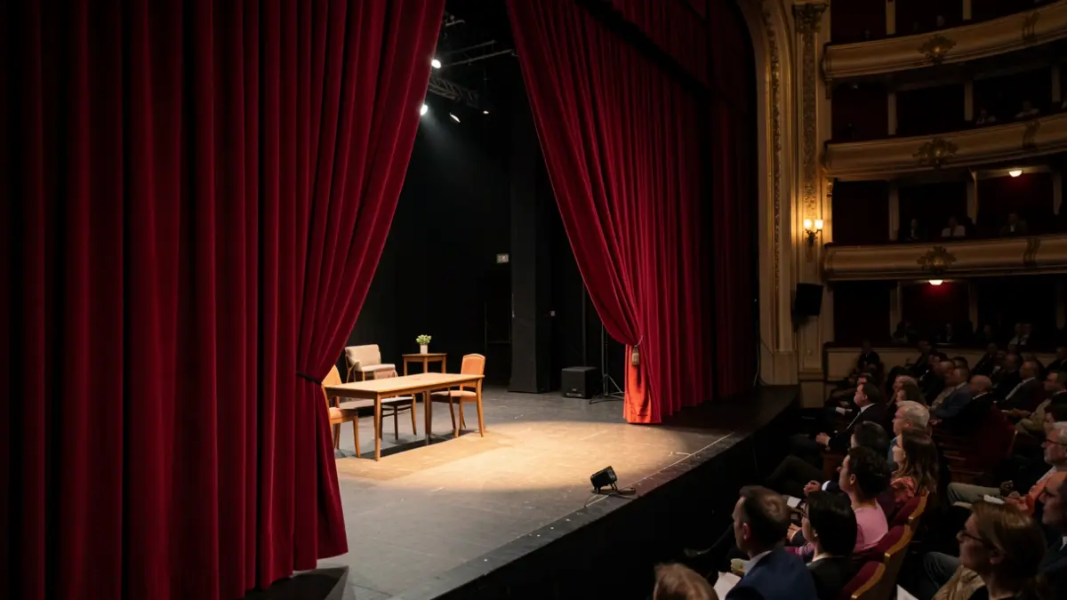 Theatre scene with red curtain and minimalist props.