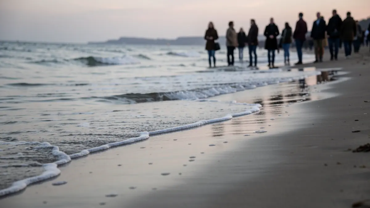 Generic image of a beach at dawn with gentle waves.