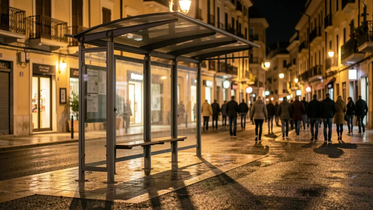 Generic image of an empty bus stop at night.