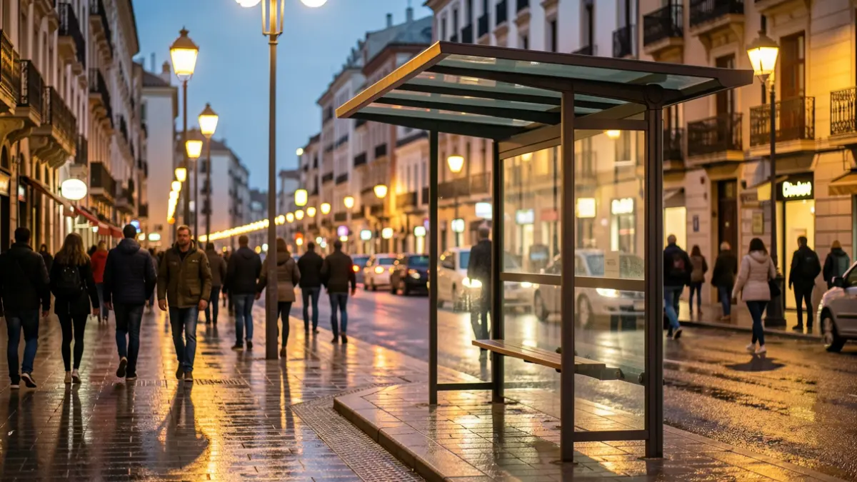 Generic image of a bus stop in a Spanish city at dusk.