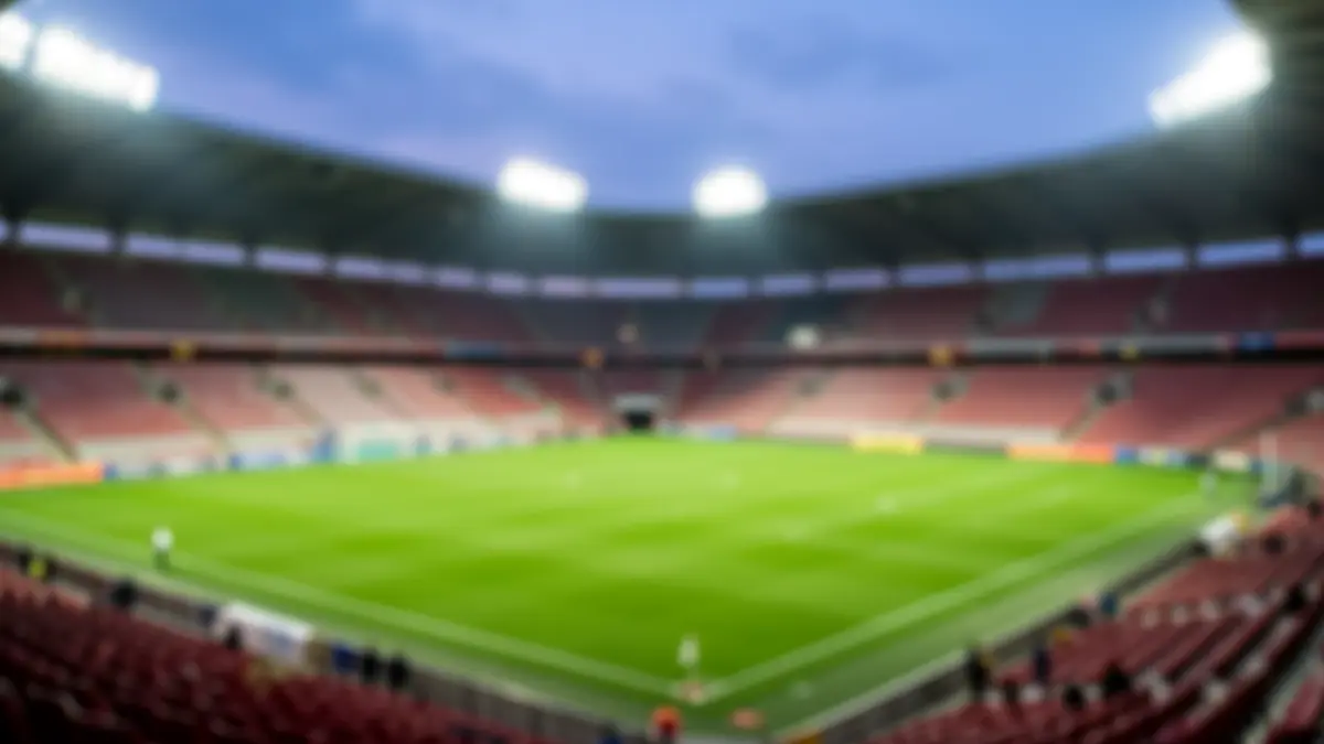 Generic image of an empty football stadium at dusk.