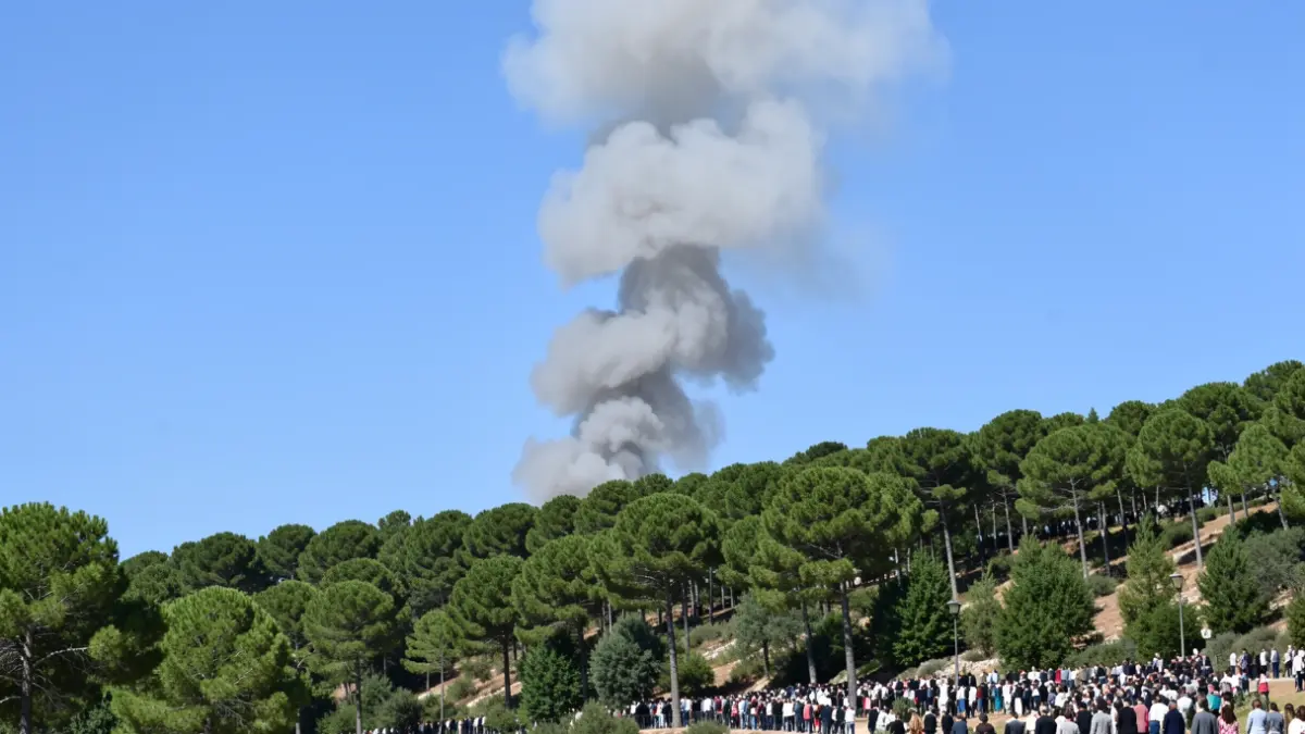 Generic image of a smoke column over a Mediterranean forest.