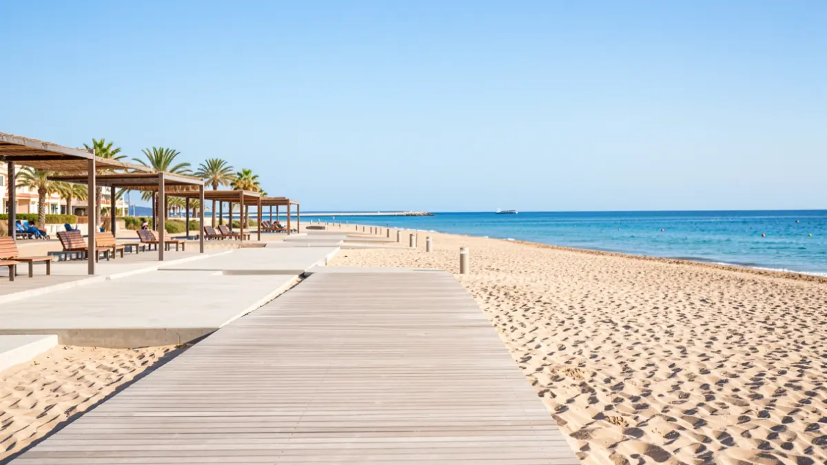 Garrucha beach with concrete boardwalks and shaded areas.