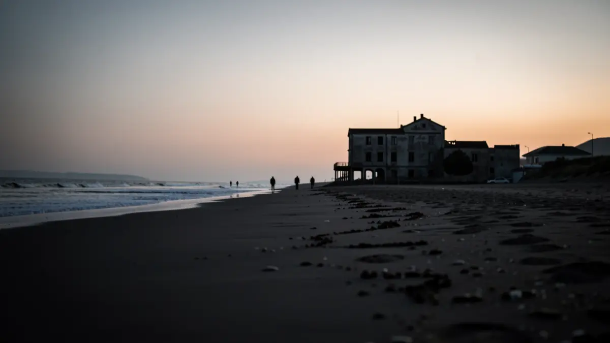 Image of a deserted beach at dawn with suspicious figures near an abandoned building.