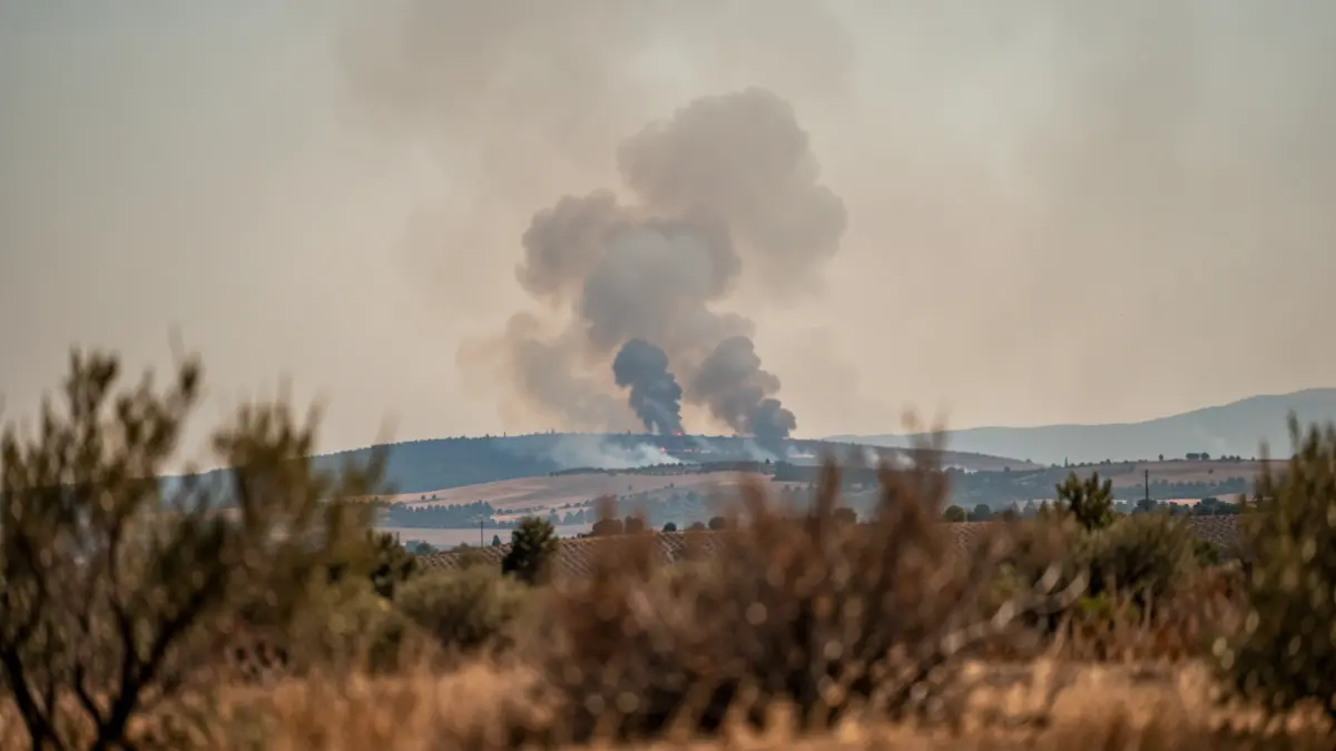 Generic image of smoke rising over a hillside in Andalusia.