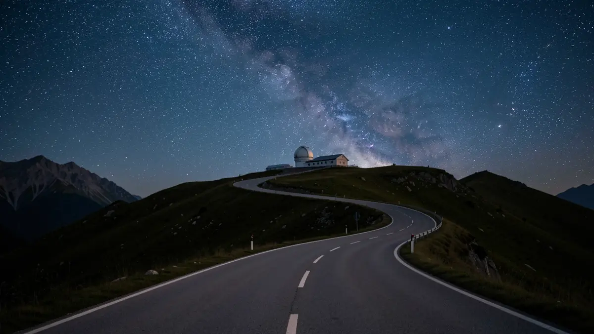 Access road to Calar Alto Observatory under a starry night sky.
