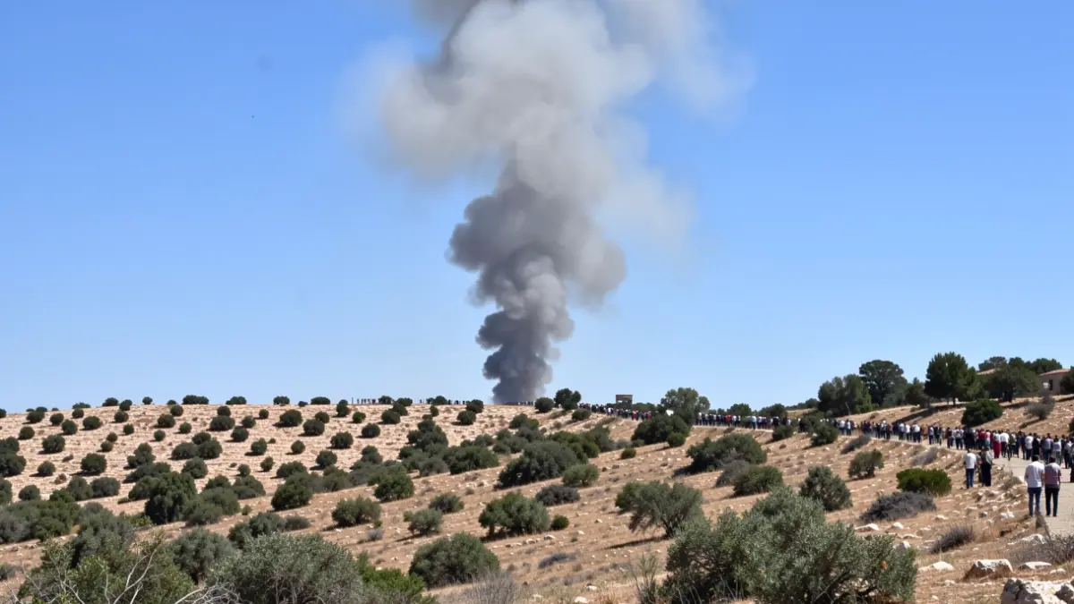 Column of smoke over a forest area in the province of Cadiz.