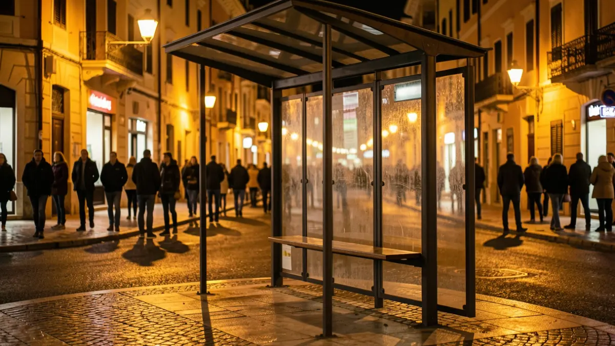 Generic image of an empty bus stop at night.