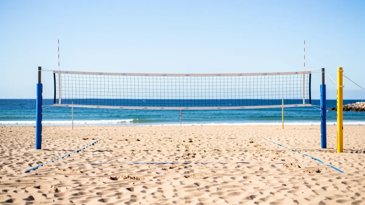Beach volleyball court on La Barrosa beach, Chiclana, with the sea in the background.