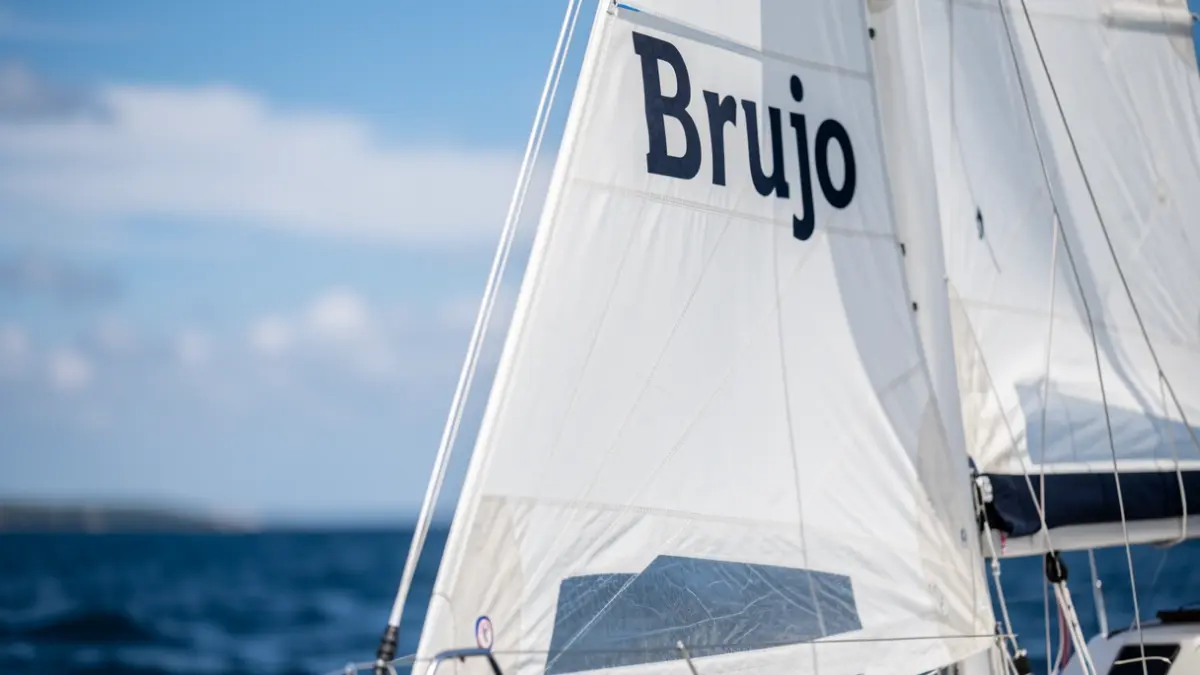 Detail of the 'Brujo' sailboat's sail during the regatta.