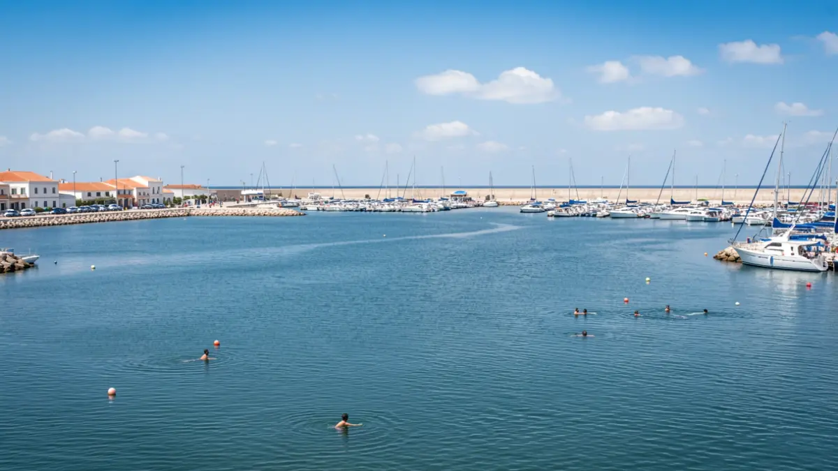 Generic image of the Port of Motril with calm waters and a clear sky.