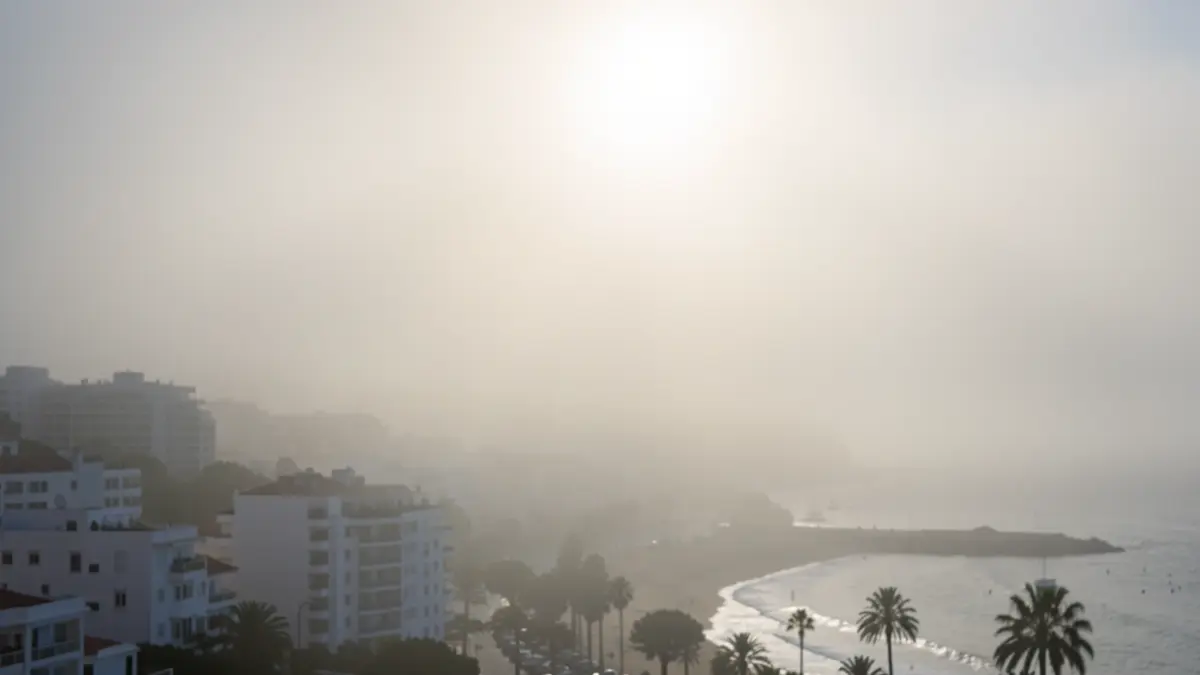 Morning fog over the coast of Torremolinos with the sun trying to break through.