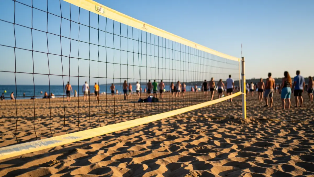 Beach volleyball net on La Victoria beach, Cádiz, at sunset.