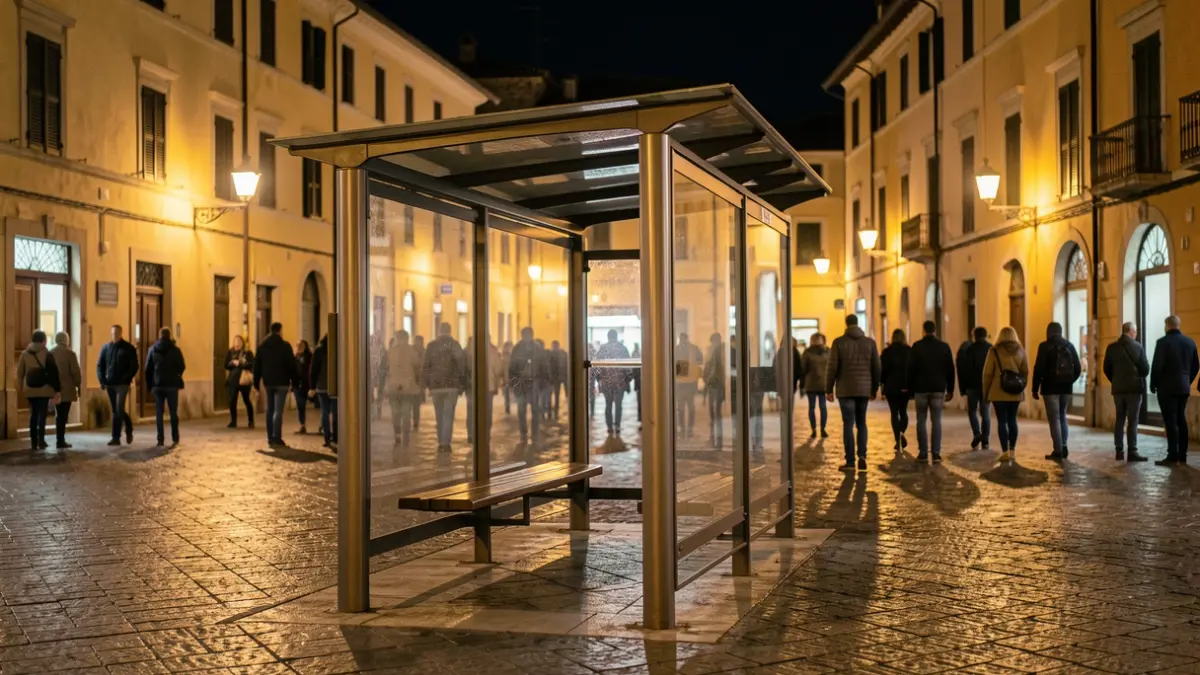 Generic image of an empty bus stop at night in a Mediterranean town square.